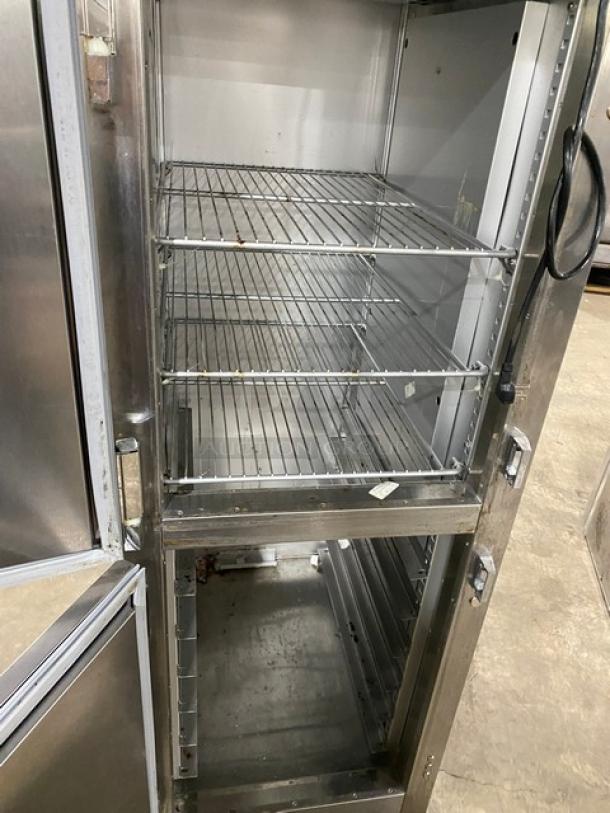 Traulsen AHT132DUT-HHS commercial stainless steel half door refrigerator with wired racks, on casters. 115V, 1 phase.