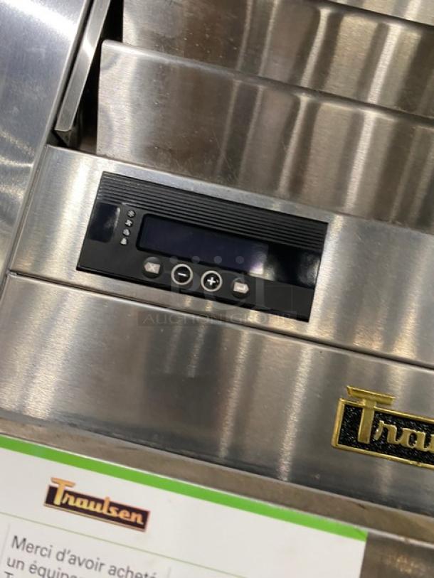 Traulsen stainless steel half-door reach-in refrigerator, model AHT132DUTHHS, with digital control panel and logo.