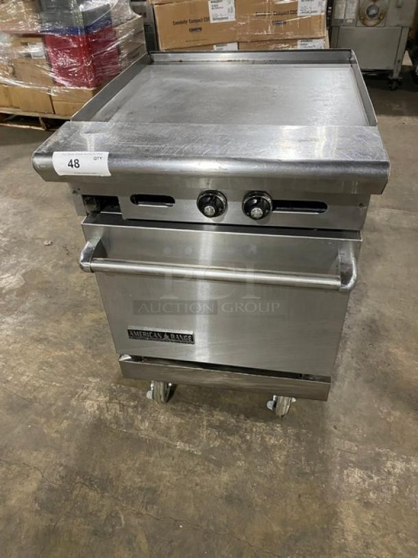 American Range commercial stainless steel natural gas flat top range/oven combo with wired oven rack and casters.
