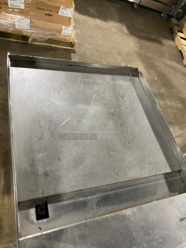 American Range commercial stainless steel flat top range/oven combo on casters, includes wired oven rack, natural gas powered.