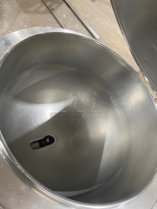 Groen AH/1-40 stainless steel steam kettle, 40 lb capacity, gas-powered, on legs. Interior view, smooth finish, excellent condition.