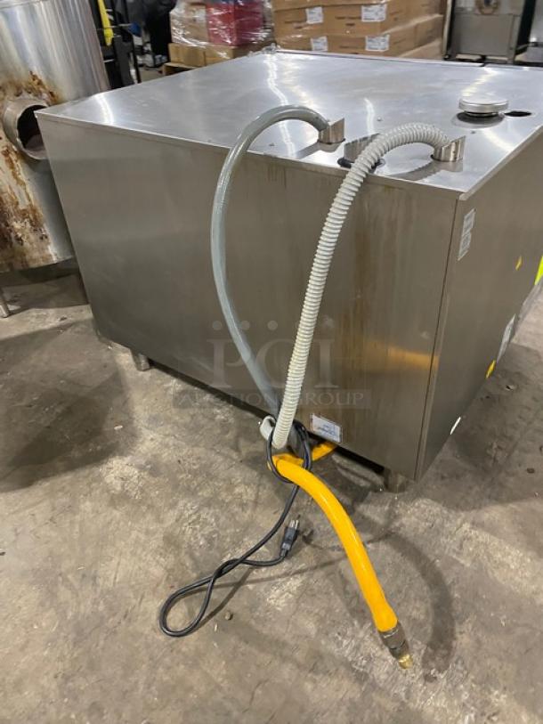 Rational SCCWE62G stainless steel combi oven, natural gas, 6-pan capacity, Energy Star certified, with gas hose and wired racks.