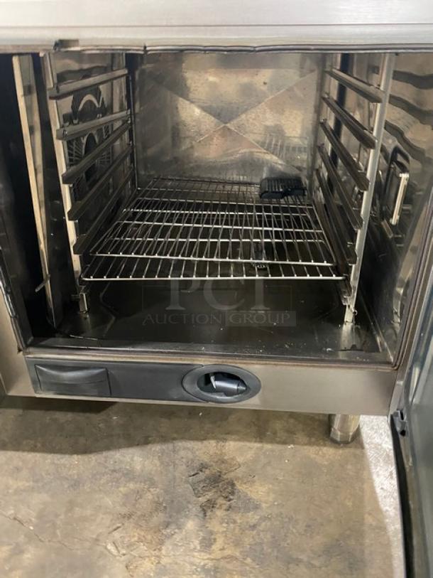 Rational SCCWE62G 6-Pan Combi Oven, stainless steel, natural gas, Energy Star certified, wired racks, gas hose, on legs.