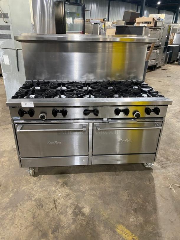 Garland SunFire X6010RR 10-burner range with double ovens, backsplash, overhead salamander shelf, and casters.