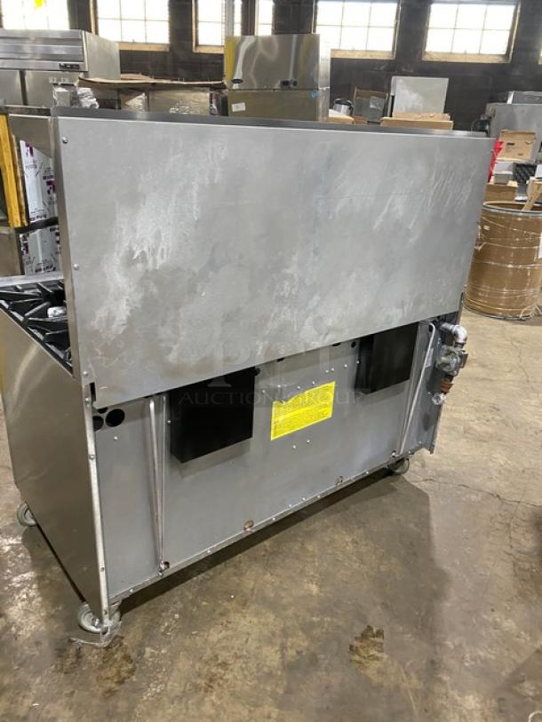 Garland SunFire Series 10-burner range/double oven combo, model X60-10RR, stainless steel, with backsplash, casters, and overhead salamander shelf.