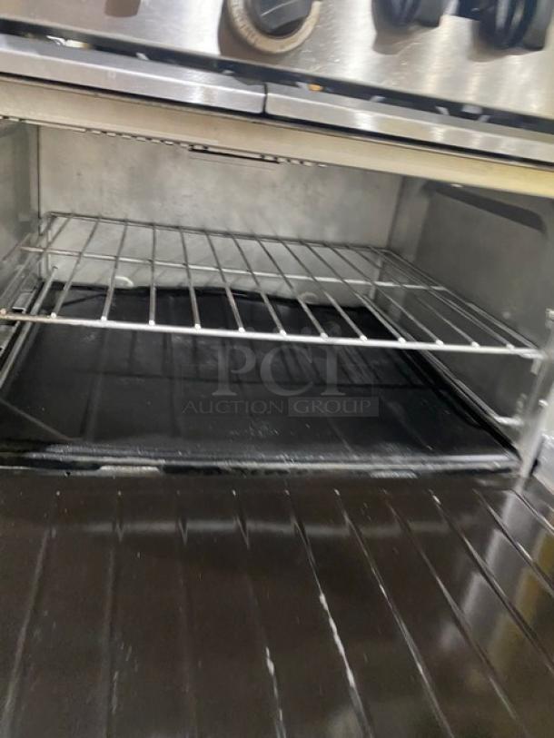 Garland SunFire Series stainless steel 10-burner range with double oven. Includes wired oven rack. Model X60-10RR.