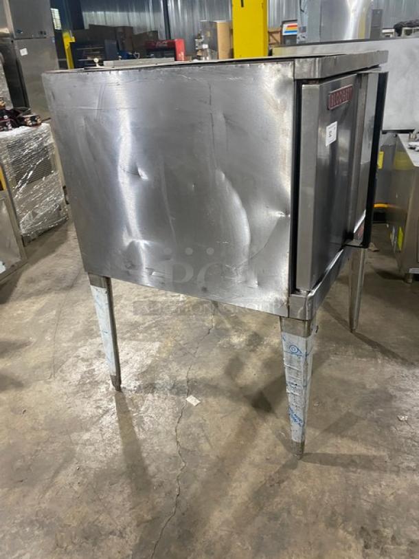 Blodgett commercial stainless steel convection oven on legs, featuring thermostatic controls and wired racks. Slight wear visible.