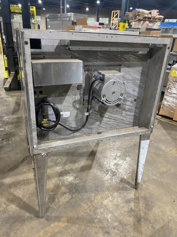 Blodgett stainless steel single stack convection oven, electric powered, with thermostatic controls and wired racks, on legs.