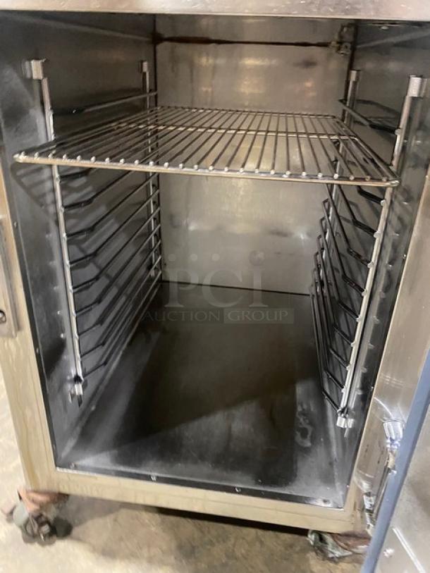 Alto-Shaam 2016 stainless steel electric heated holding cabinet, model 500-S, on casters, with pan holding racks.