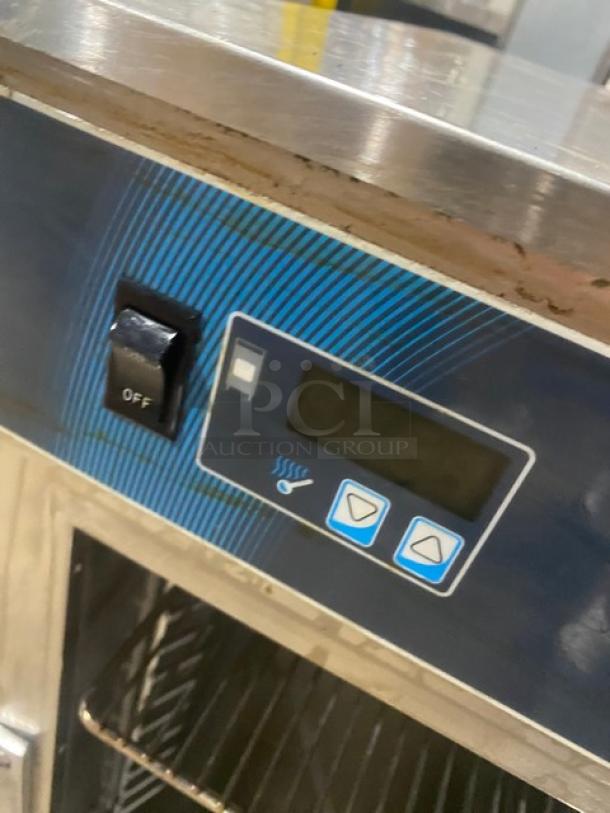Alto-Shaam model 500S control panel, features on/off switch and digital display, part of stainless steel heated cabinet.
