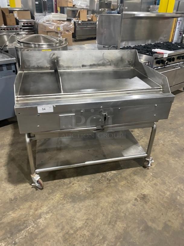 WoodStone stainless steel natural gas countertop plancha griddle with back and side splash, undershelf cart, and casters.