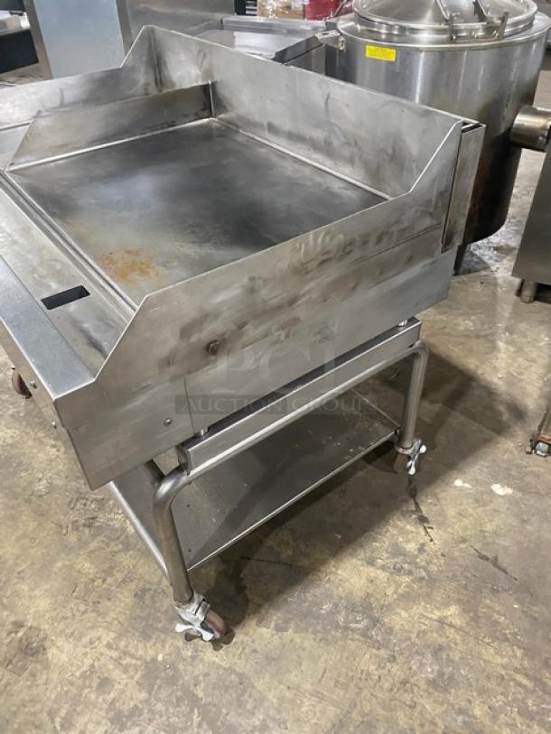 WoodStone commercial stainless steel natural gas countertop plancha griddle with back and side splash, undershelf cart, on casters.