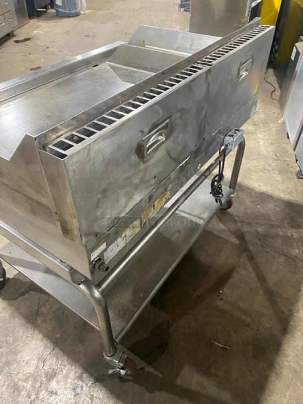 WoodStone stainless steel natural gas countertop plancha griddle with back and side splash, single undershelf cart on casters.