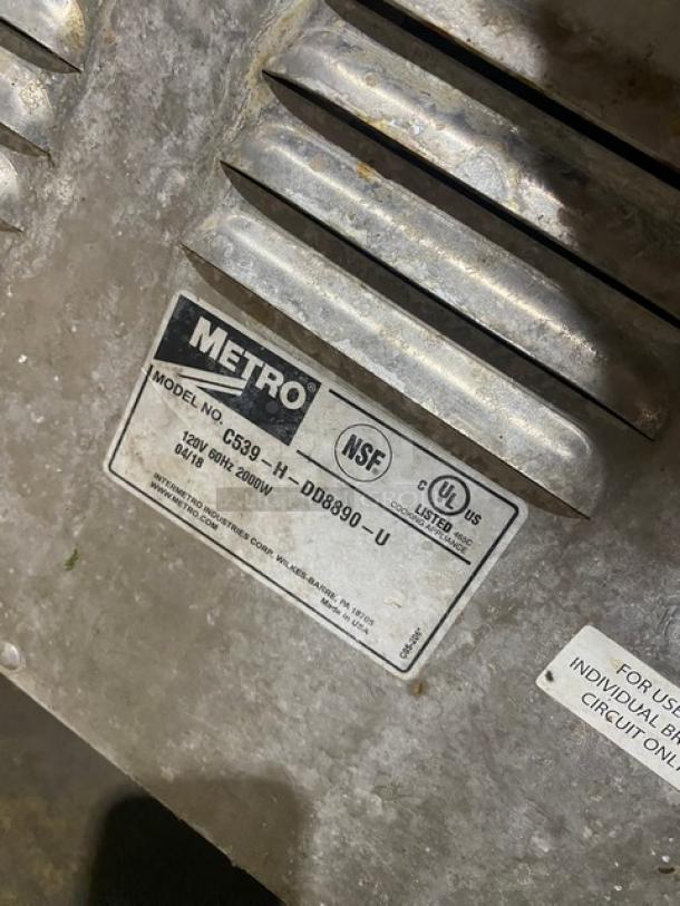 Metro C5 3-Series Heated Cabinet, Model C539-H-DD8890-U, 120V, on casters, label with NSF and UL listings visible.