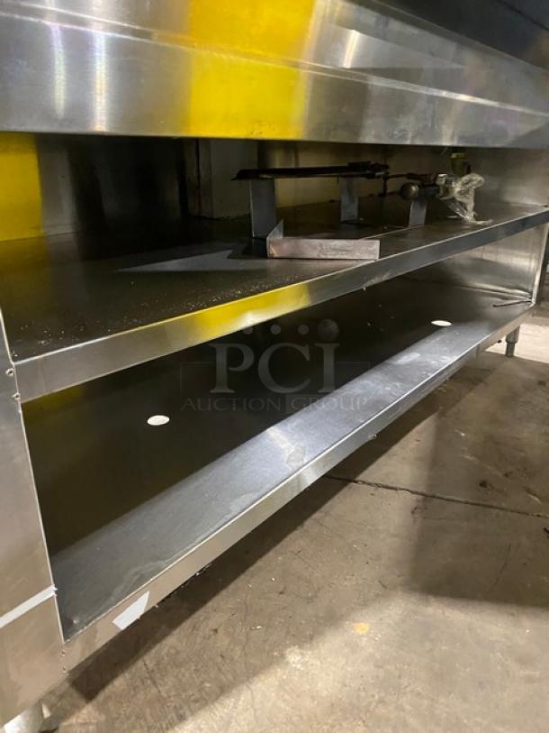 Commercial stainless steel 5-bay hot food steam table with sneeze guard, tray-slide, and enclosed double shelf base.