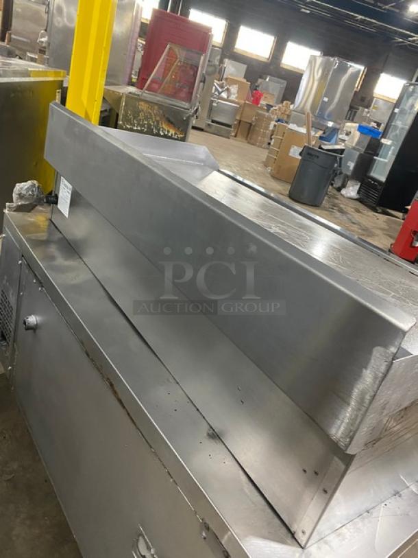 Connerton CG48M stainless steel countertop flat griddle with back and side splash, natural gas, model CG-48M, SN: 104027J21.