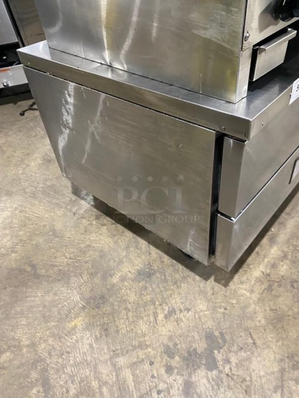 Migali stainless steel 2-drawer refrigerated chef base on casters, commercial-grade. Good condition, sturdy design.