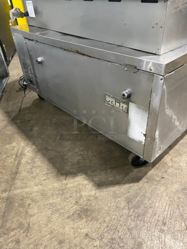 Migali commercial stainless steel 2 drawer refrigerated chef base on casters. Slight wear visible. Model C5F10.