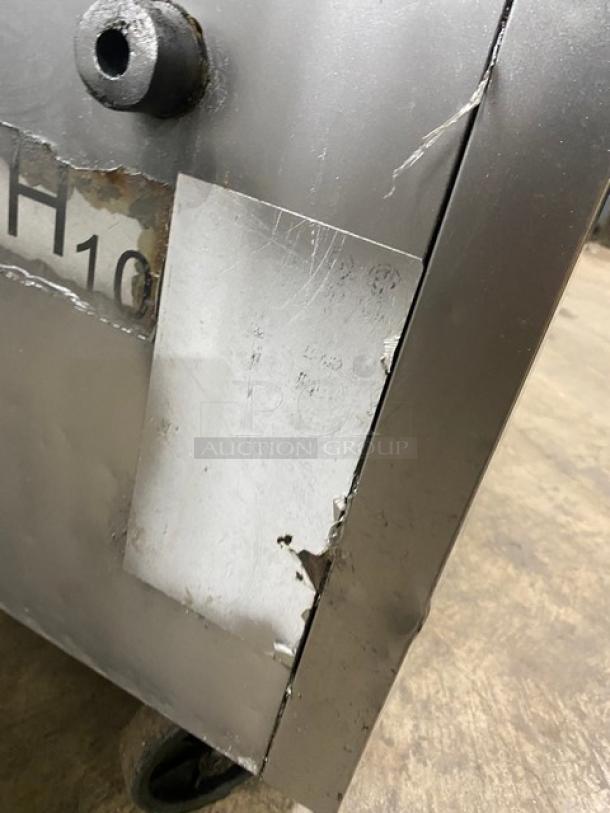 Migali stainless steel 2-drawer refrigerated chef base on casters. Visible wear and tear on the surface.