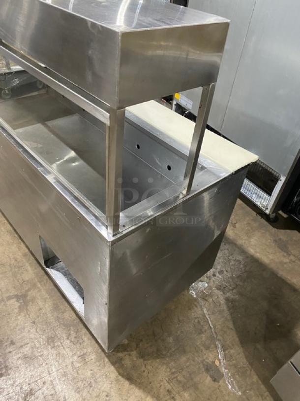 Commercial stainless steel 2-door refrigerated prep table with cutting board, overhead shelf, sneeze guard, and wired racks.
