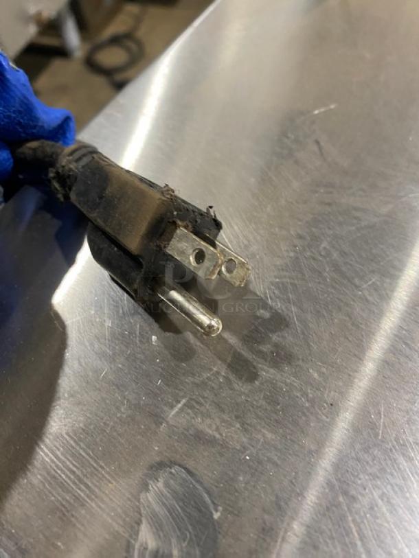 Plug for Wells RWN2 commercial stainless steel electric warming drawer, 120V, showing signs of wear.