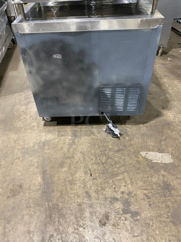 Leader 2-door stainless steel refrigerated worktop, Model LB36SC, includes wired rack, 115V 1 Phase, on casters.