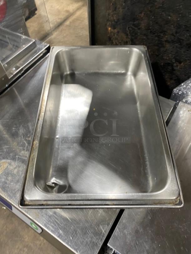 Lot of commercial stainless steel steamtable pans, lightly used. Features durable construction, ideal for hotel use.