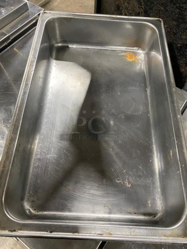 Lot of commercial stainless steel hotel steamtable pans. Visible wear and some rust. Sold as-is, all one money.