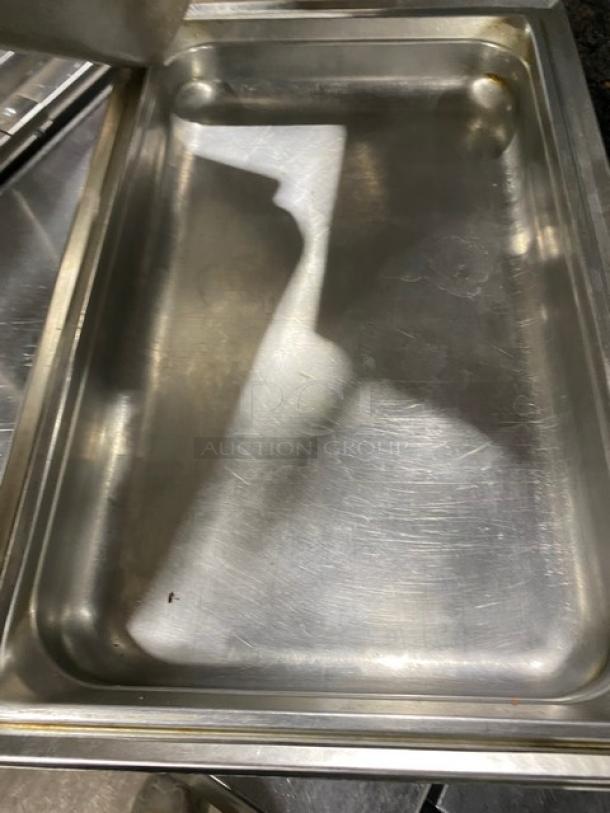 Stainless steel hotel/steamtable pan in used condition with visible scratches. Ideal for commercial use.