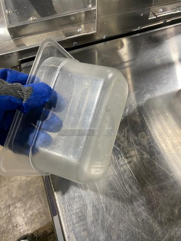 Lot of commercial stainless steel and clear polycarbonate food pans, ideal for hotel steam tables, in used condition.