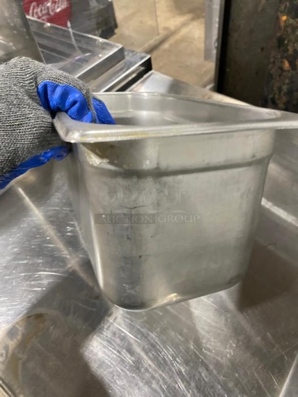 Lot of stainless steel hotel steam table pans, commercial grade, with visible wear. Ideal for catering or restaurant use.