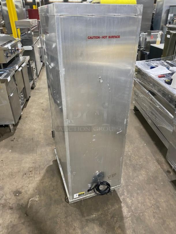 Serv-Ware SC1836HPI heated cabinet on casters, electric-powered, full-height, stainless steel, 120V, labeled "Caution: Hot Surface".