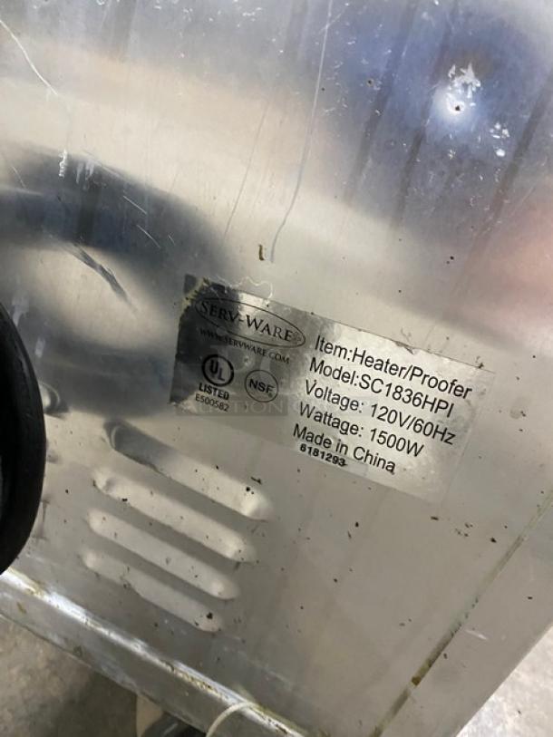 Serv-Ware full-height heated holding cabinet, model SC1836HPI, on casters, 120V, SN: 6181293, 1500W, made in China.