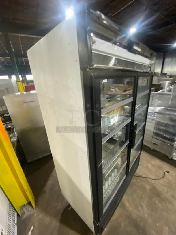 True GDM-49 commercial double glass door refrigerator with poly coated wire racks, beverage organizers; Model: GDM-49 SN: 1-2816143.