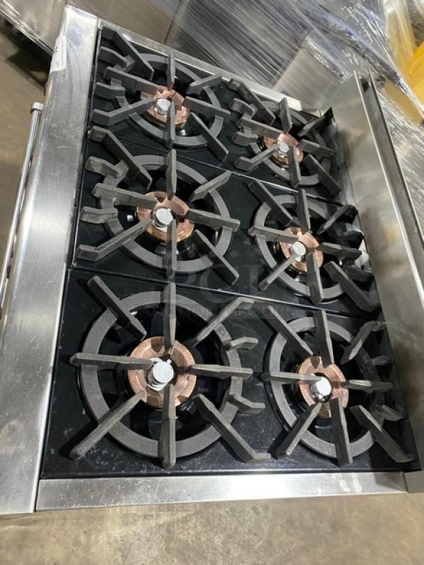 Wolf Gourmet Series stainless steel 6-burner natural gas range/oven combo, features wired oven rack, excellent condition.
