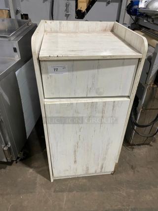 Commercial wooden enclosed-style trash cabinet, distressed finish, good condition, auction label indicating item 77.