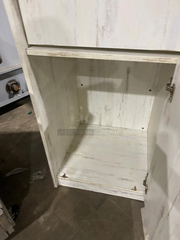 Commercial wooden enclosed-style trash cabinet, distressed white finish, open door view, good condition.