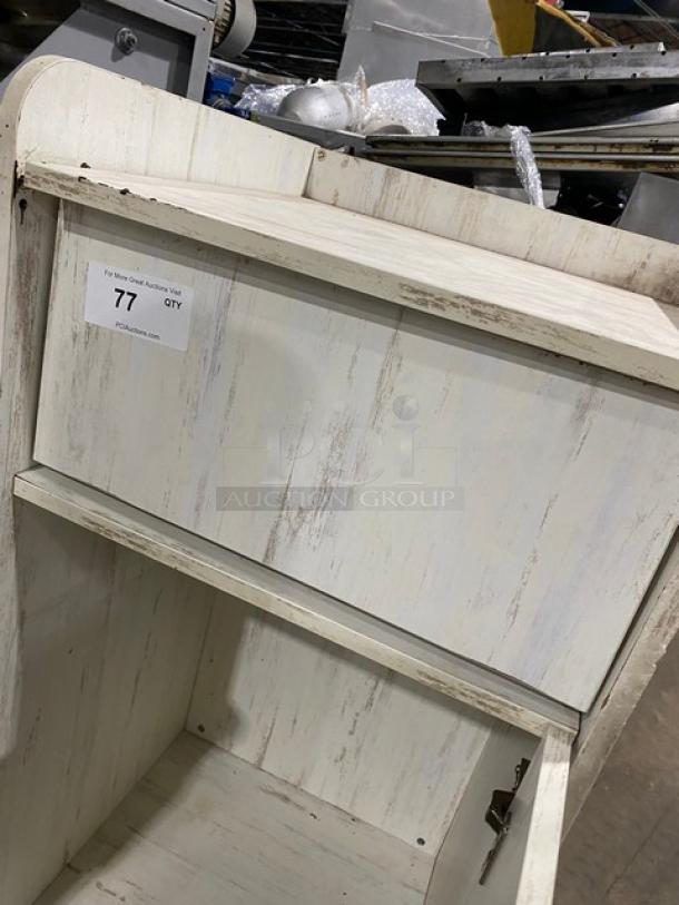 Commercial wooden enclosed-style waste receptacle cabinet, light distressed finish, moderate wear. Auction tag reads "77 QTY."