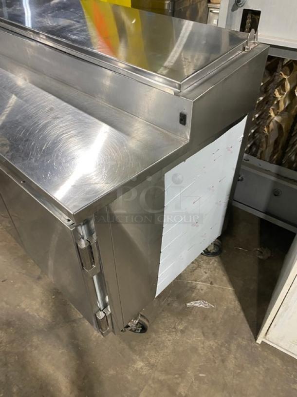 Marsal BM72R 3-door pizza prep table, stainless steel, built-in pan slides, shelving, casters, no compressor.