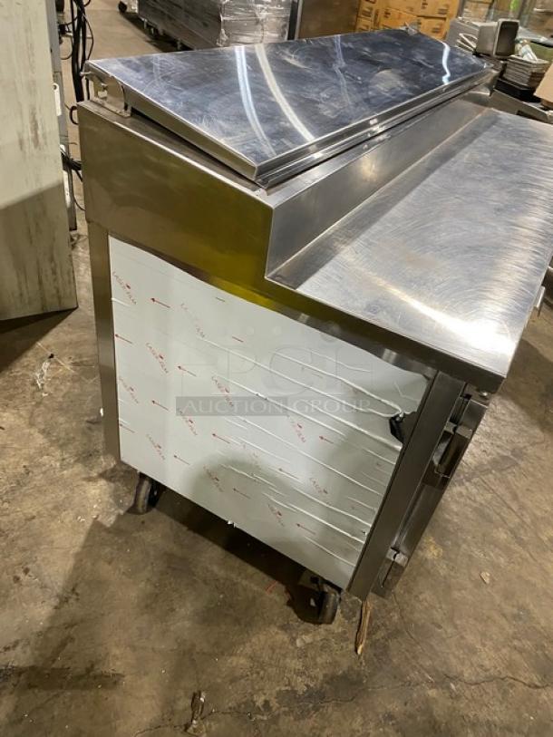 Marsal BM72R 3-door refrigerated pizza prep table, stainless steel, 72", late model, built-in pan slides, on casters.