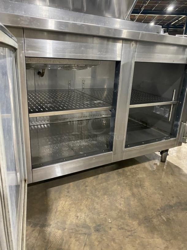 Marsal BM72R 72" stainless steel 3-door pizza prep table, with built-in pan slides, shelving, no compressor, on casters.