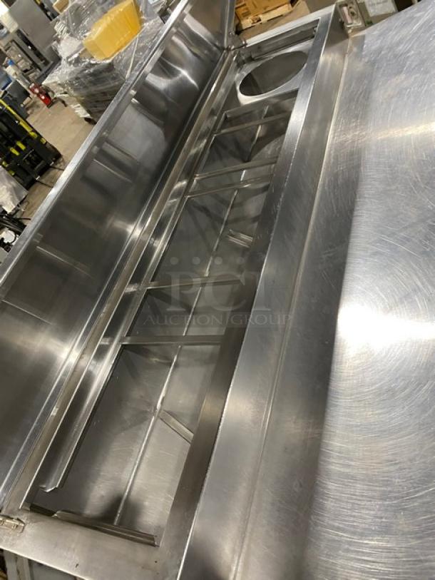 Marsal BM72R stainless steel 3-door refrigerated pizza prep table, bain marie style, built-in pan slides, on casters.