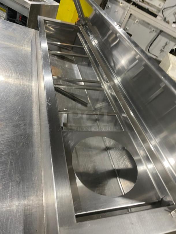 Marsal BM72R stainless steel 3-door refrigerated pizza prep table with pan slides and shelving, no compressor, on casters.