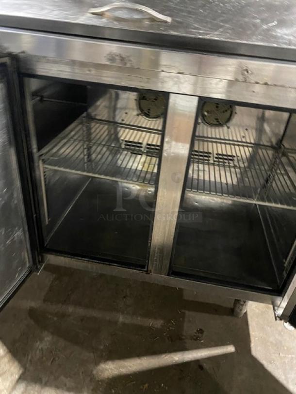 Turbo-Air JBT48 Bain Marie display table, stainless steel, 2-door, poly-coated wire rack, model JBT-48, 115V, on legs.