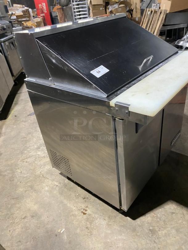 Universal Coolers 2 Door Stainless Steel Refrigerated Prep Table, Model SC36BMI, with cutting board and wire rack, on casters.