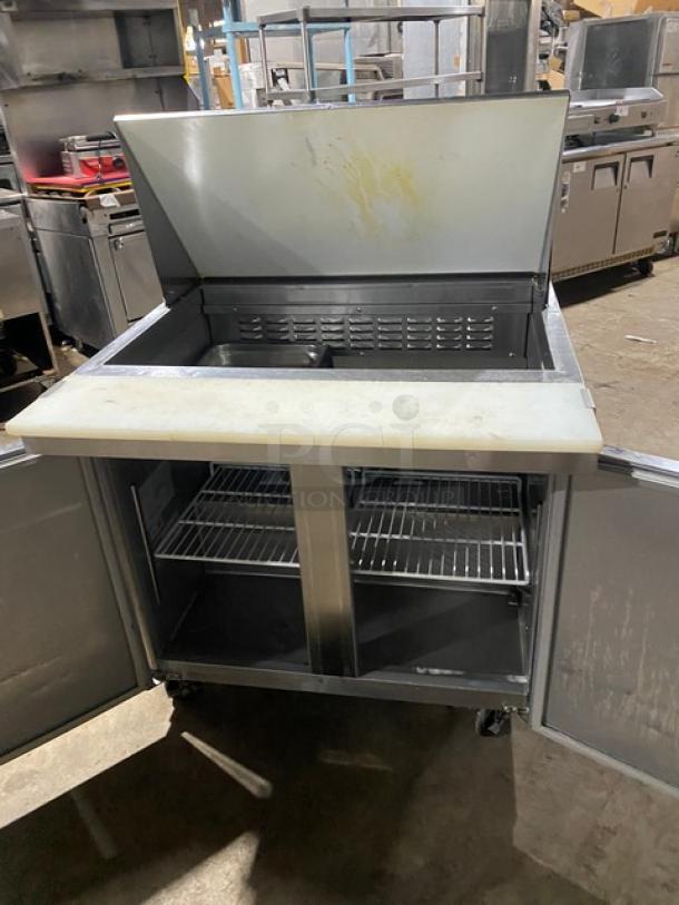 Universal Coolers SC36BMI stainless steel 2-door refrigerated Bain Marie prep table with cutting board, wire rack, on casters.