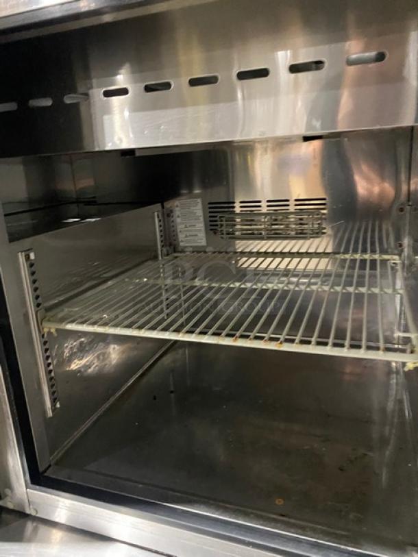 Turbo-Air stainless steel single door refrigerated prep table, model JST-36-N, with poly coated wire rack.