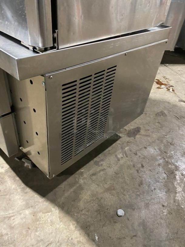 Commercial stainless steel 2-drawer refrigerated chef base, 115V, on casters, visible side ventilation panel, used condition.