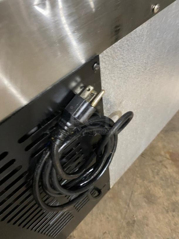 Commercial stainless steel 2-drawer refrigerated chef base, 115V, on casters. Power cord included. Ideal for kitchens.