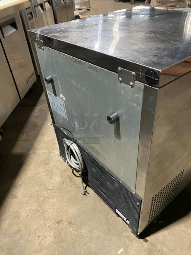 Turbo-Air stainless steel undercounter worktop refrigerator on casters. Features a solid single door and poly-coated wire rack.